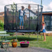 woman-jumping-on-plum-spacezone-ii-evolution-trampoline-with-child-watching
