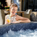 woman-relaxing-beside-lay-z-spa-carrara-airjet