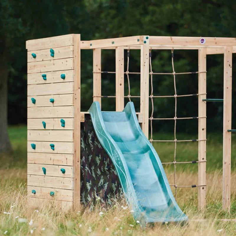 wooden-climbing-cube-with-slide-climbing-wall-and-rope-net-in-grass