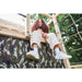 wooden-climbing-cube-with-swing-xl-girl-sitting-on-play-den-edge-lifestyle